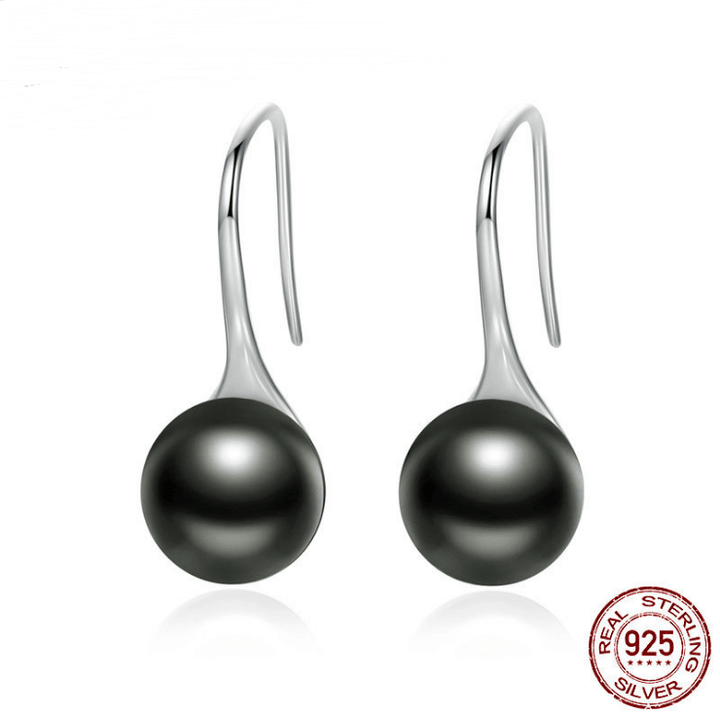 Elegant black pearl drop earrings with sterling silver hooks, featuring a timeless and sophisticated design.