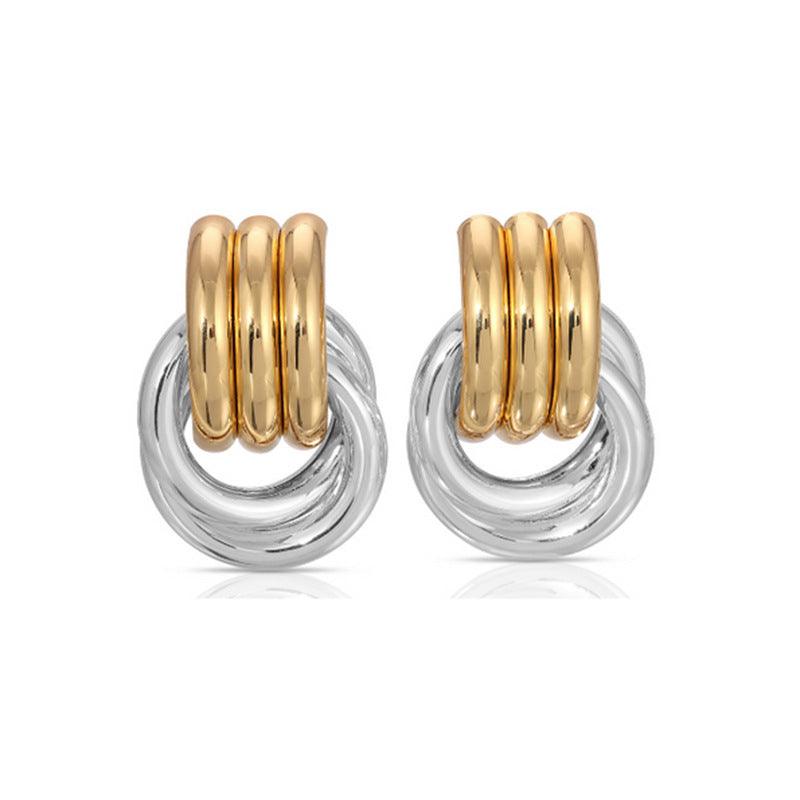 A pair of interlocking hoop earrings featuring a dual-tone design with gold-tone stacked hoops and silver-tone circular loops for a modern and elegant look.