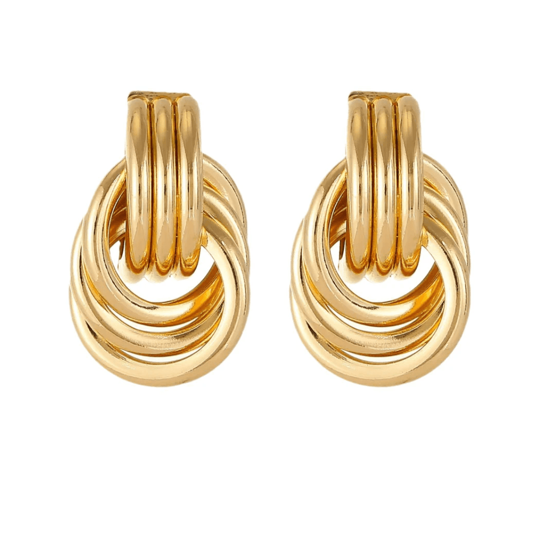 A pair of gold-tone stacked hoop earrings featuring an interlocking circular design.